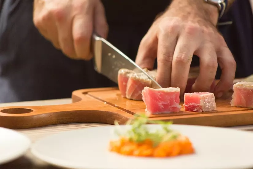 chef knife cutting fish