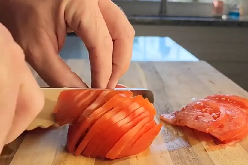 bread knife slicing tomatto